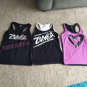 3 xxl (old sizing/fits like xl) Zumba racer backs. EUC. Purple/pink/white/black